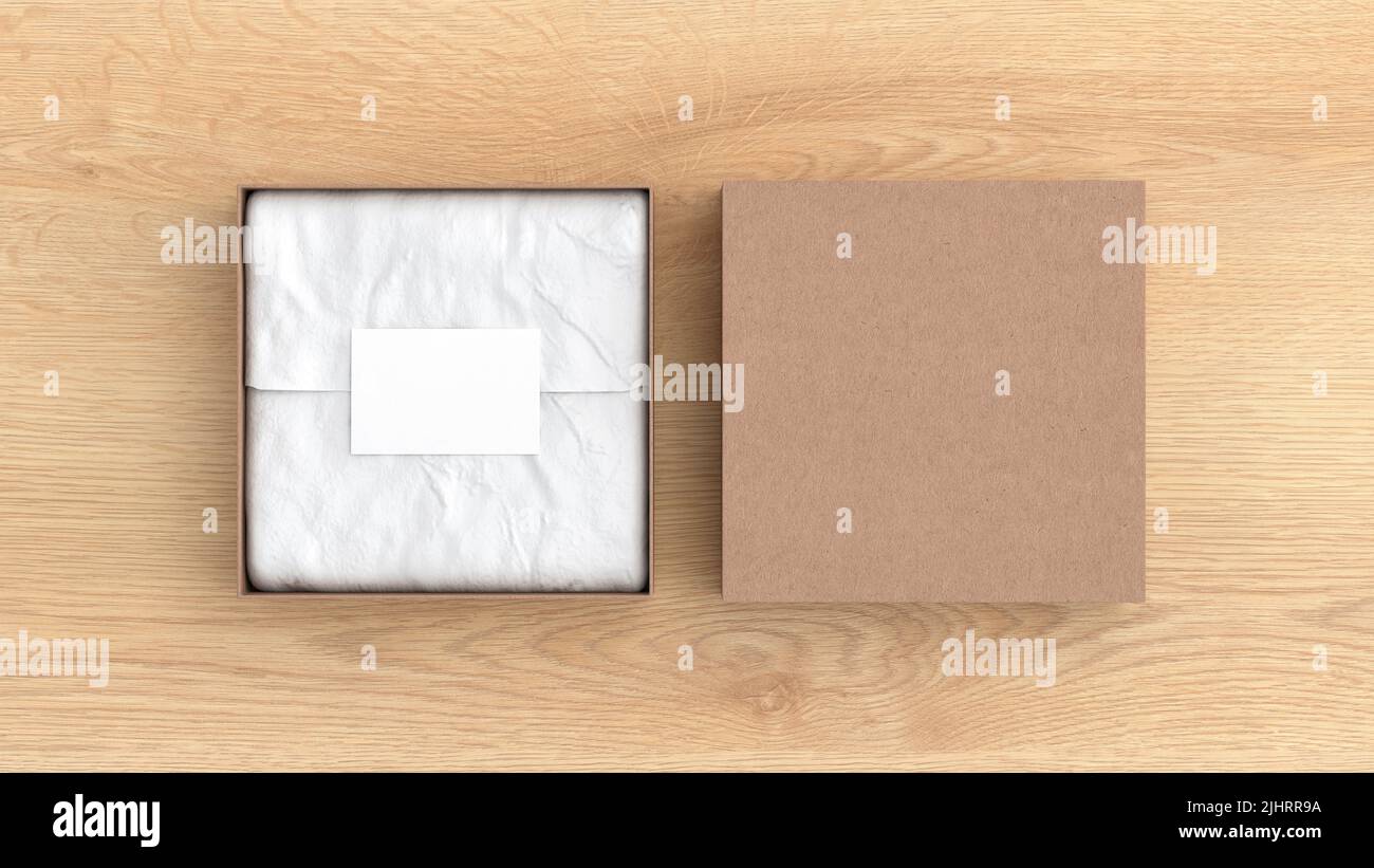 Square gift box mock up. Cardboard gift box with blank label or business card on wrapping paper. Wooden background. View directly above. 3d illustrati Stock Photo