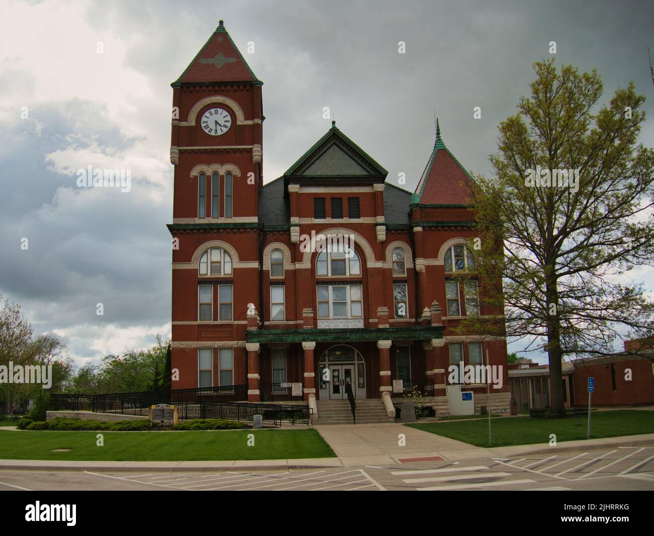 A view of a Historic Miami County Kansas (KS) Courthouse in Paola on a dark cloudy day Stock