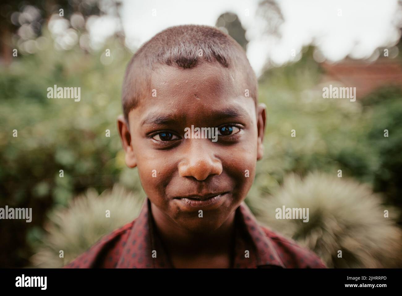 A portrait of a cute boy with smile looking at the camera Stock Photo ...