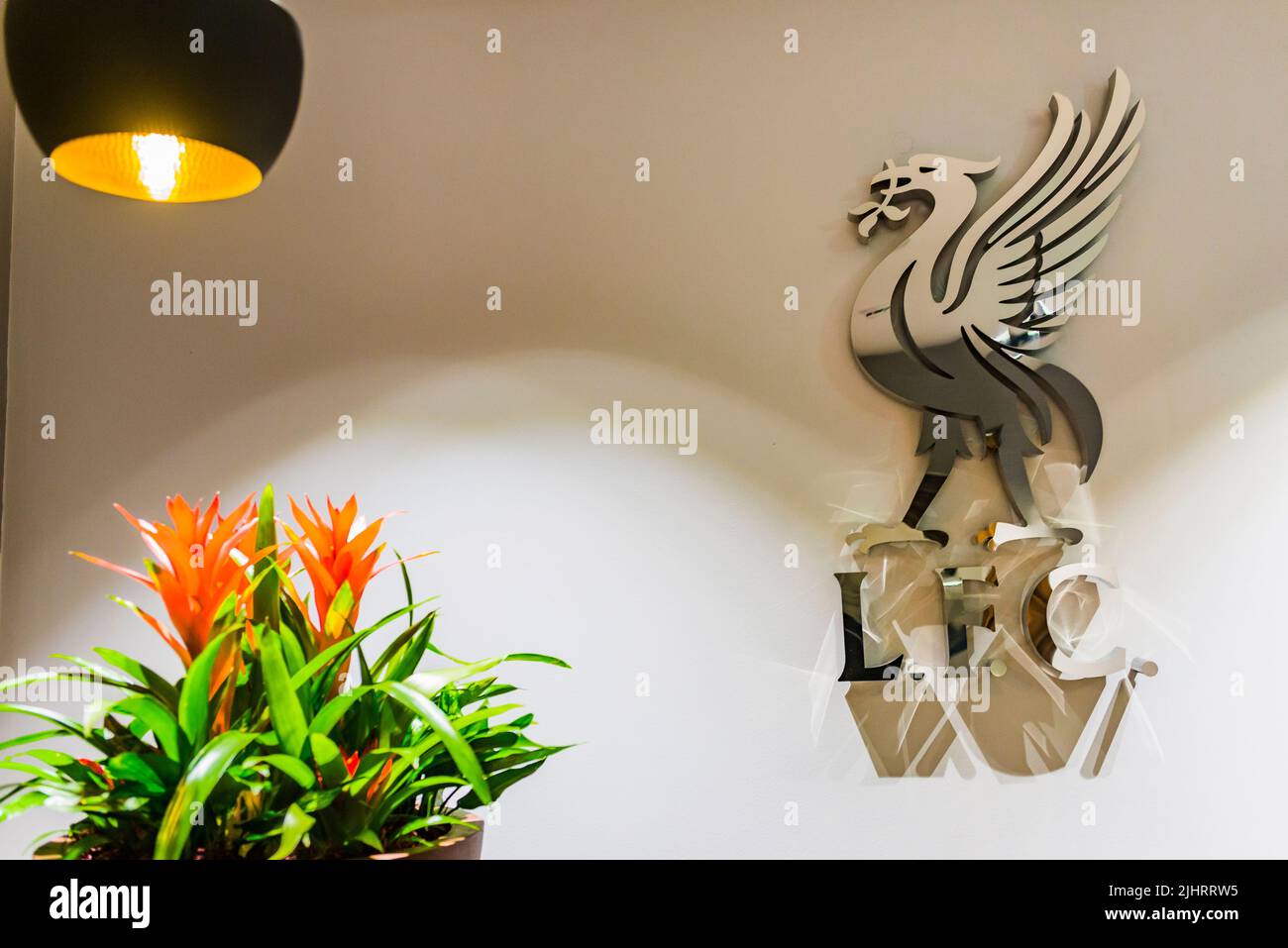 Logo. The Liverpool FC Stadium Tour, hospitality lounge. Anfield is a football stadium in Anfield, Liverpool, Merseyside, England, which has a seating Stock Photo