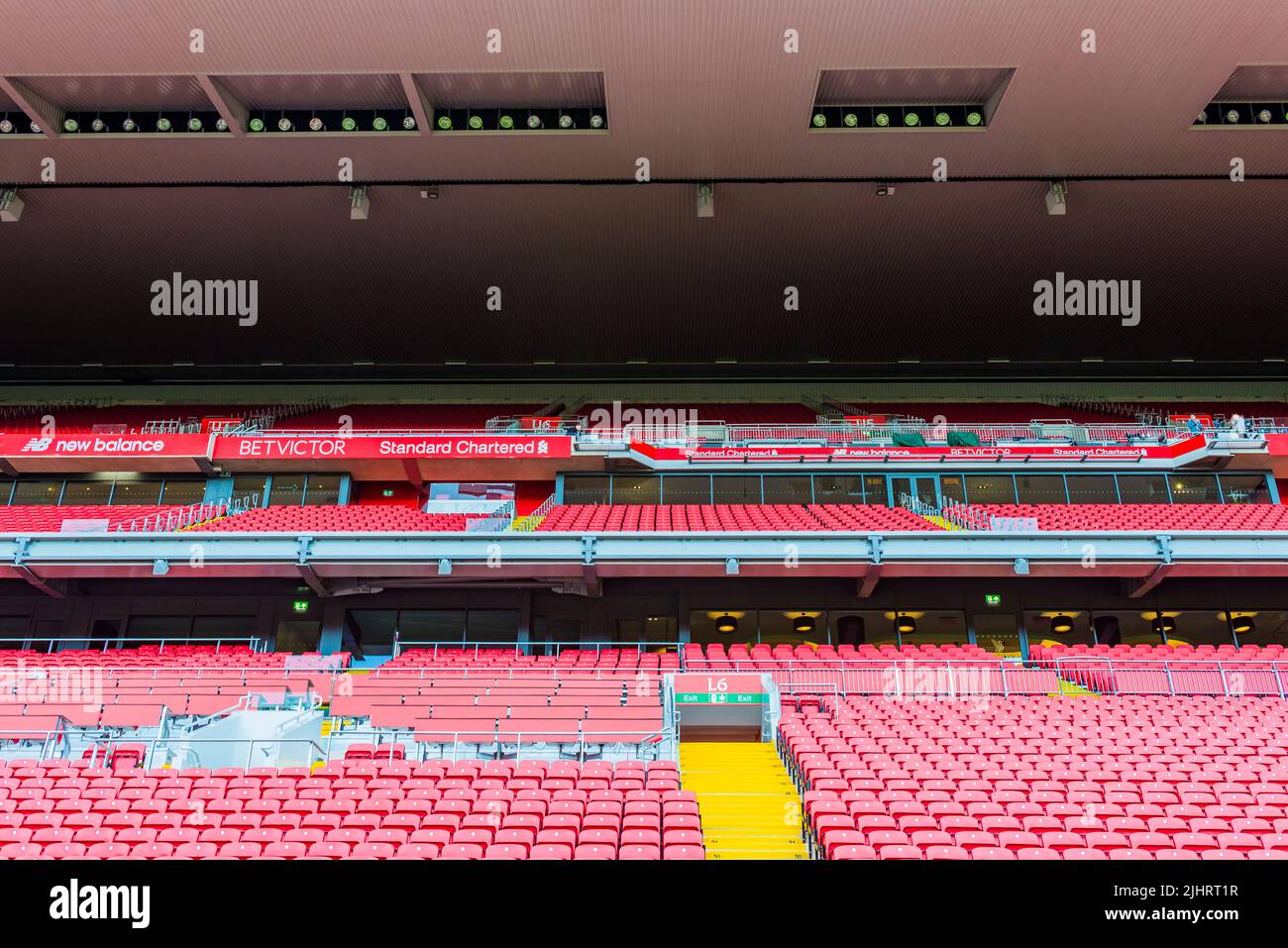 Red chairs in the Anfield stands. Anfield is a football stadium in Anfield, Liverpool, Merseyside, England, which has a seating capacity of 53,394, ma Stock Photo