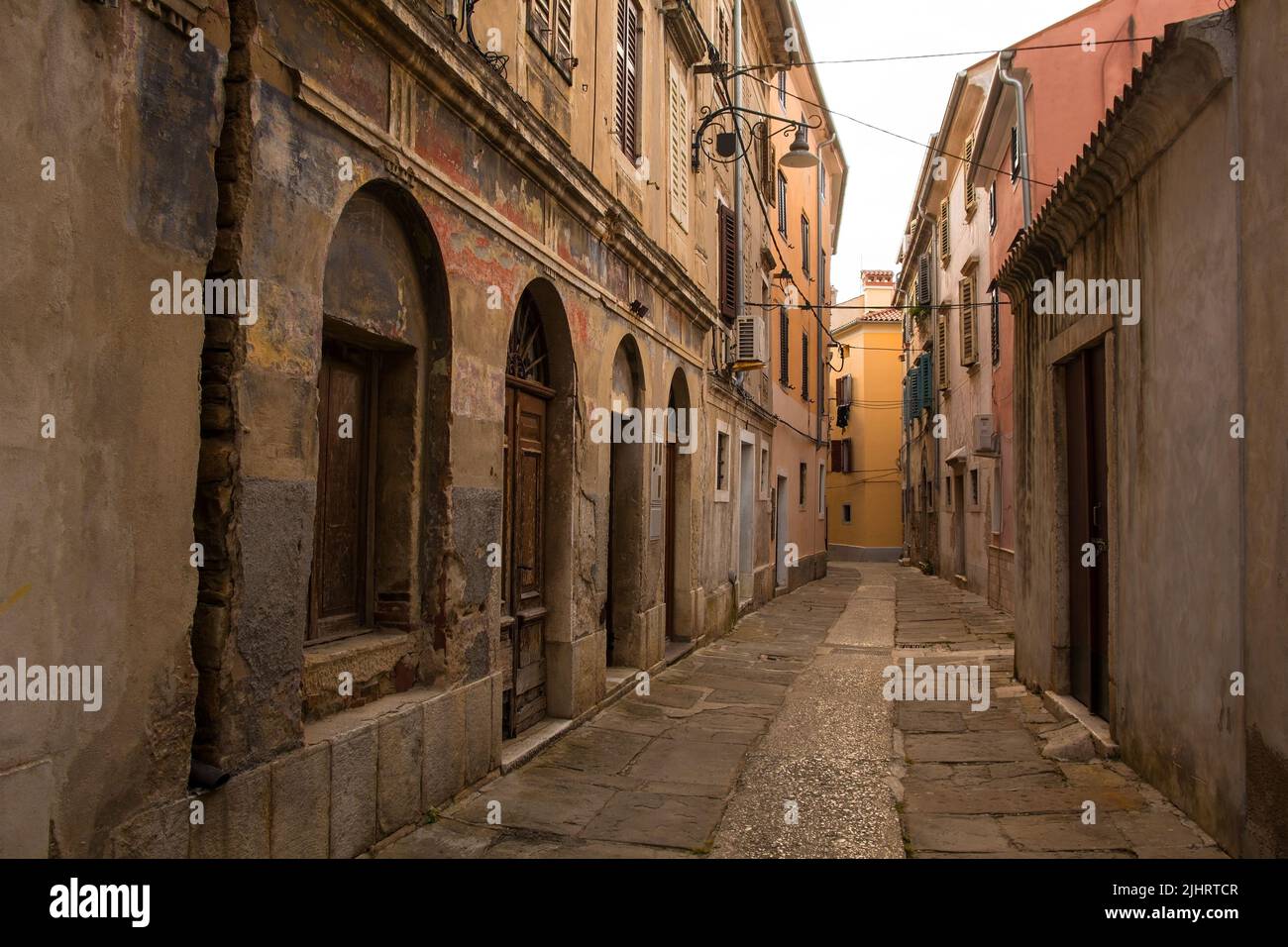 A quiet residential street in the medieval centre of Izola, Slovenia Stock Photo