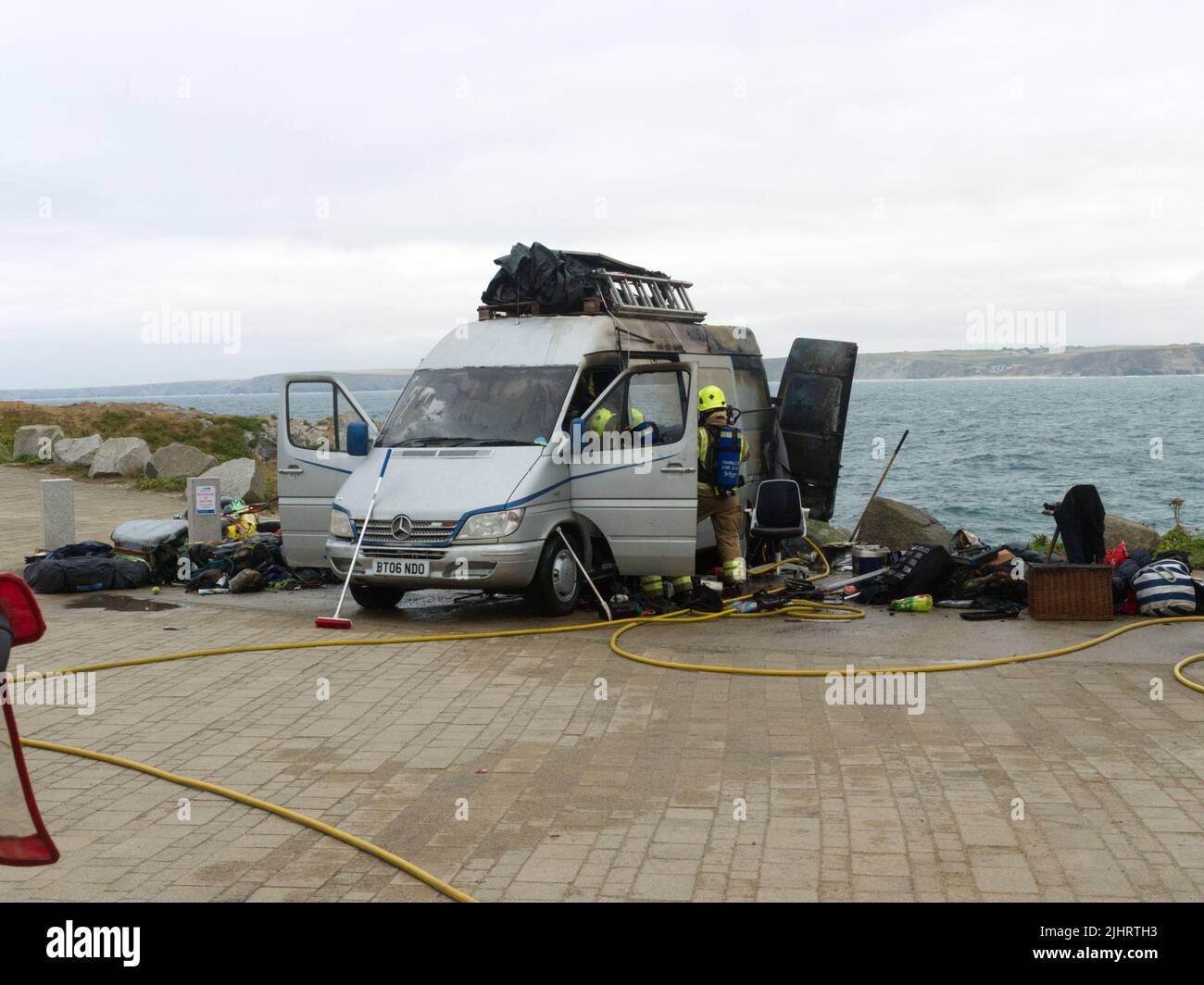 Newquay, Cornwall, UK. 20 July, 2022. Spoke-person for Van campers in a Cornish Car park dispute made claim of threats on his life in Truro magistrates court, hours later his van was engulfed by fire. Retired Army Captain Peter Elliot who saw service in Northern Ireland elected to speak up in Truro Magistrates court  court today to challenge an attempt to evict some 49 Campers and van dwellers. The Camper folk had been served with Criminal Justice and Public order 1994 (Section 27) notices to move on. Credit: Robert Taylor/Alamy Live News Stock Photo