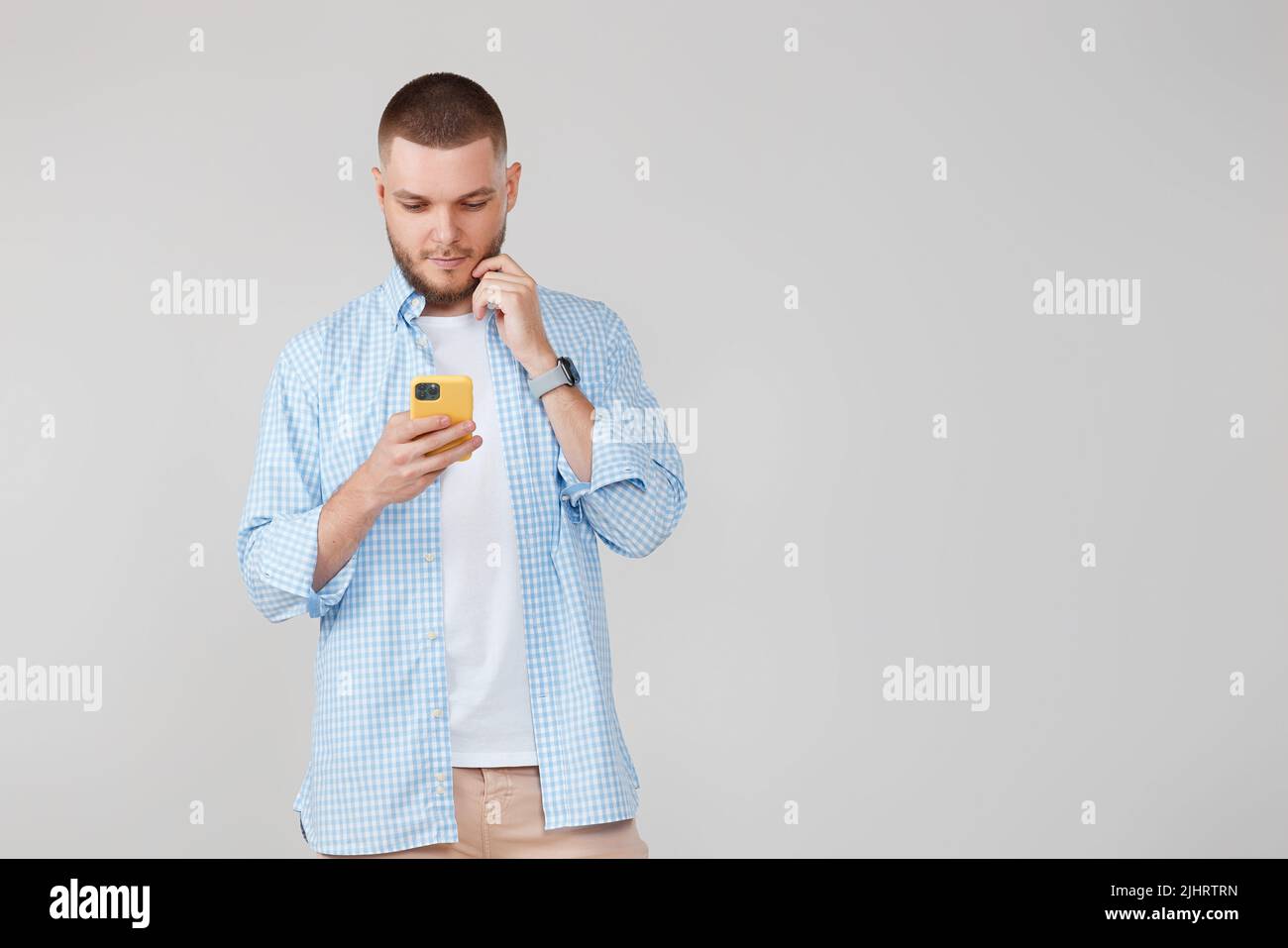 handsome man with mobile cell phone surfing internet Stock Photo