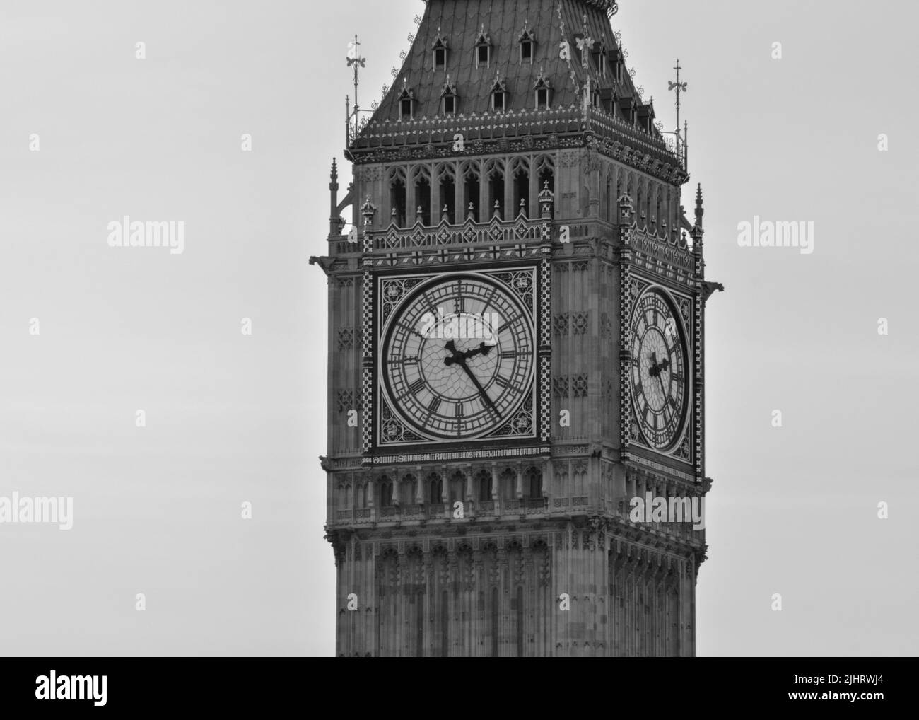 A closeup shot of the Big Ben landmark in London, England with gray sky Stock Photo