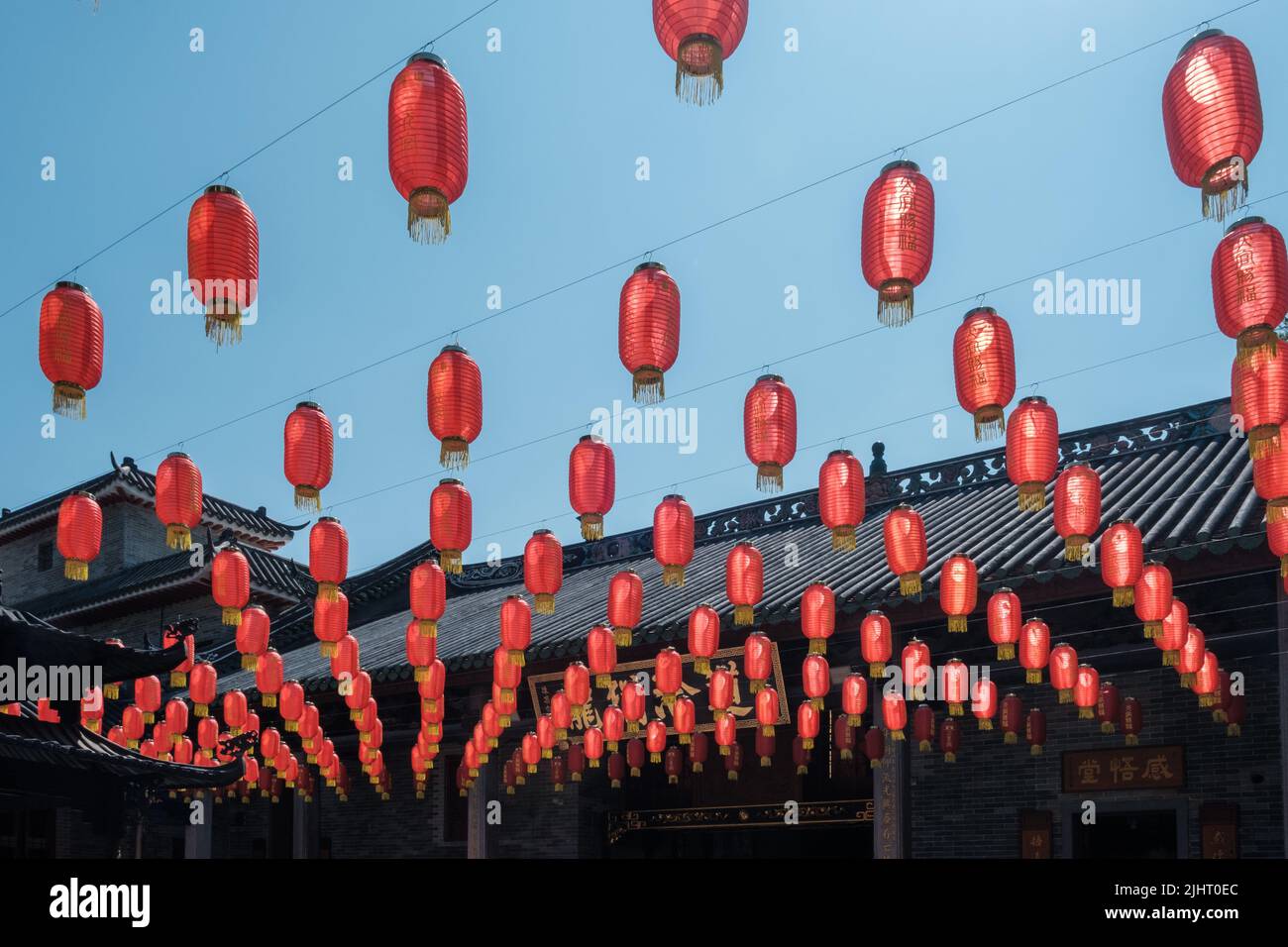 Red lanterns are hung arrayed in rows at a Taoism temple Stock Photo ...