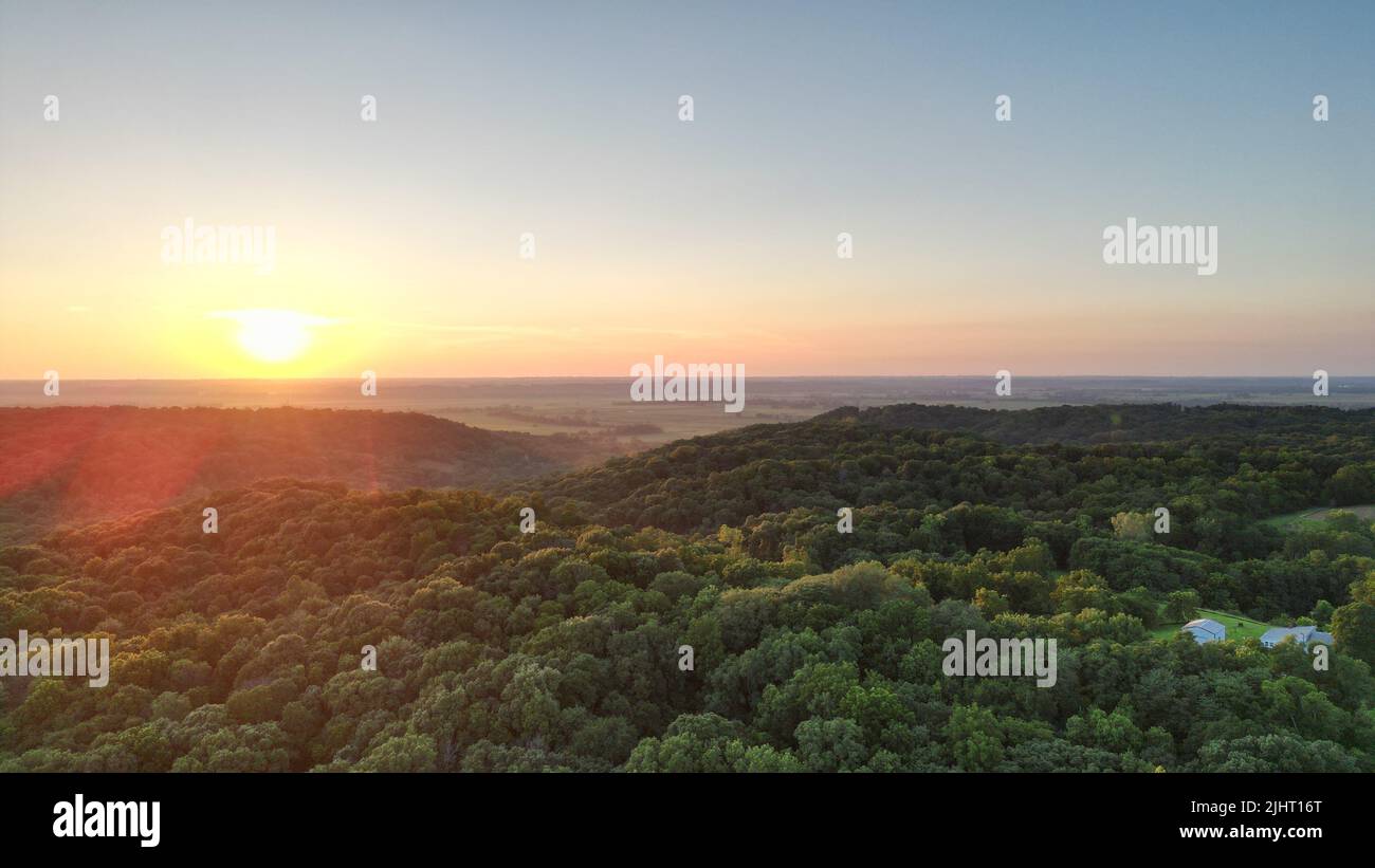 A landscape view of the green fields at sunset Stock Photo - Alamy