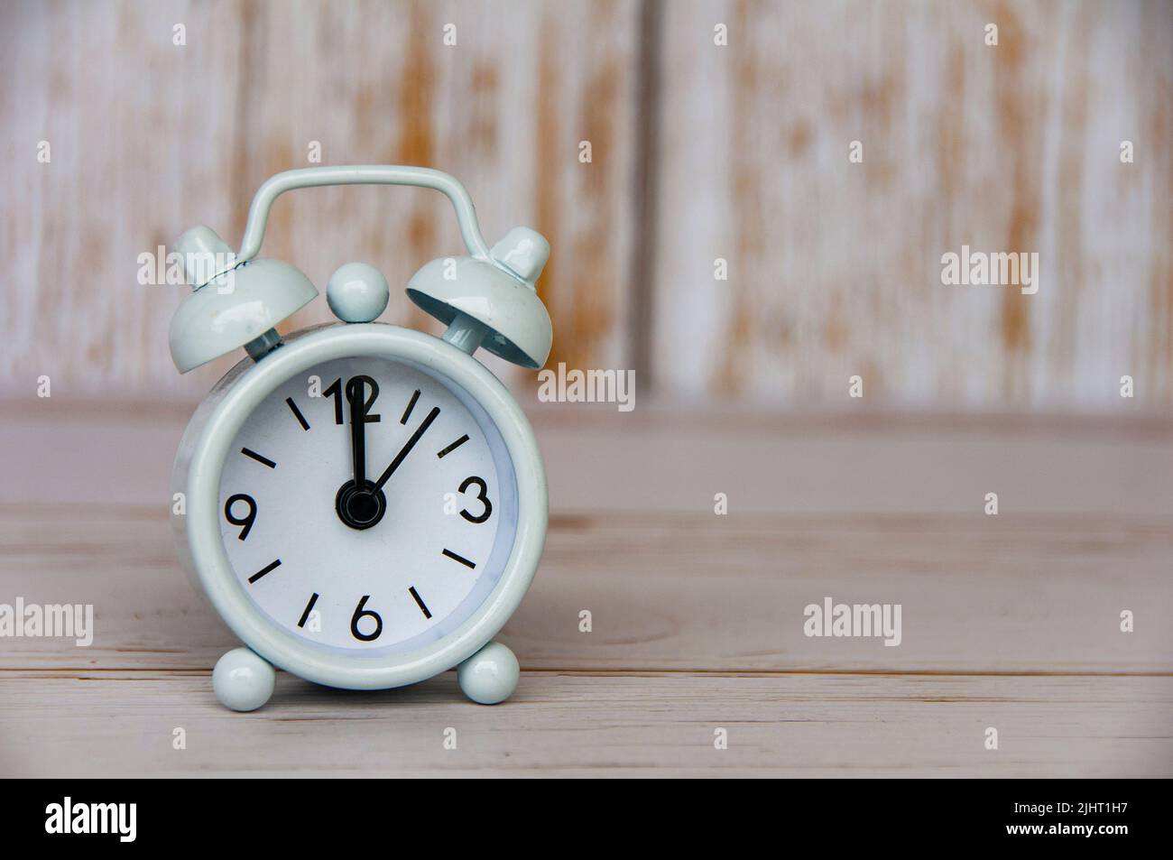 12am 12pm Clock On Wooden Table Stock Photo 611748464