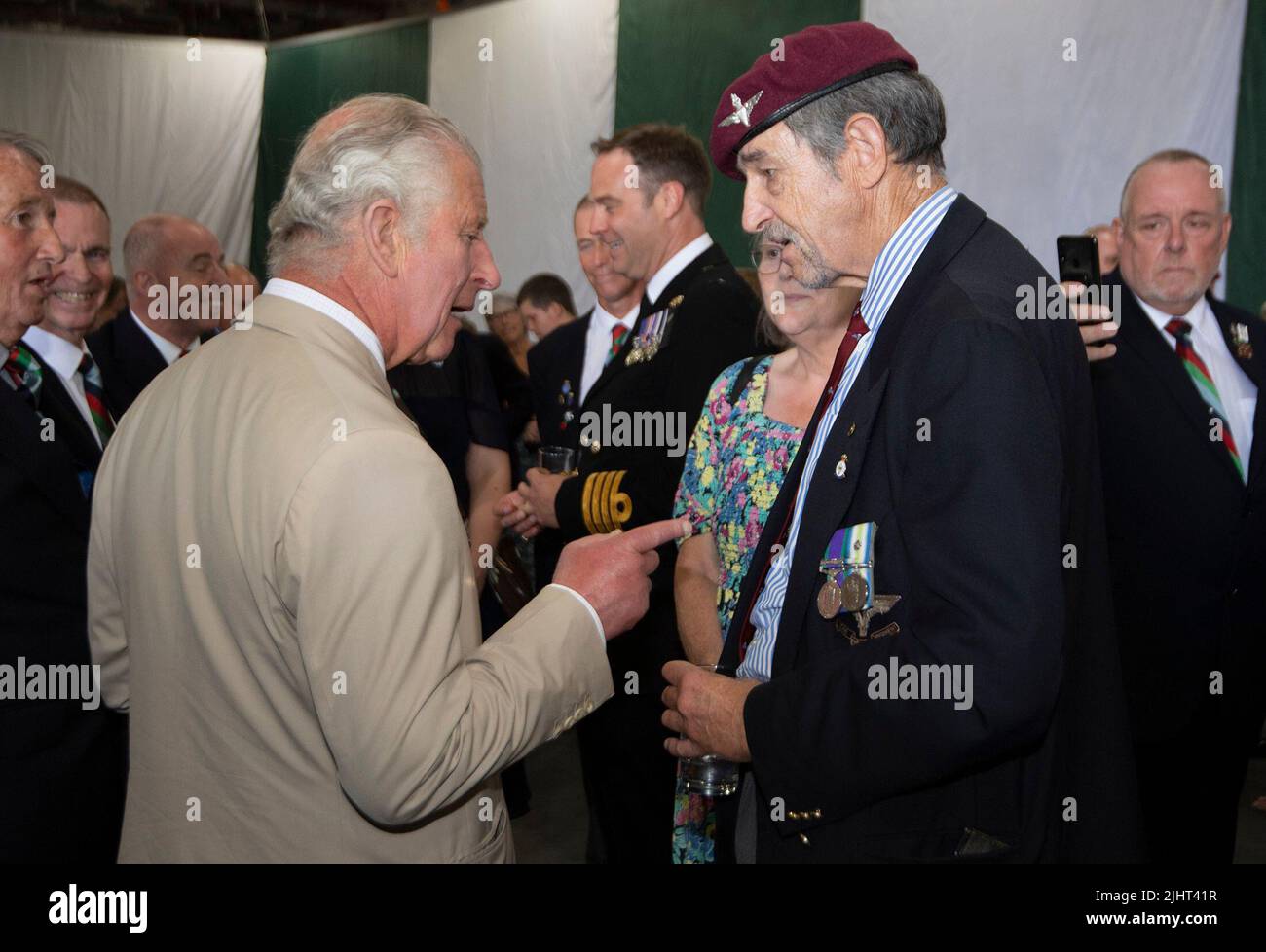 The Prince of Wales (left) talks to Falklands veteran Chris Jackson of C Company 2 Para during a reception to mark the 40th anniversary of the conflict on board the Royal Navy aircraft carrier HMS Queen Elizabeth. Picture date: Wednesday July 20, 2022. Stock Photo