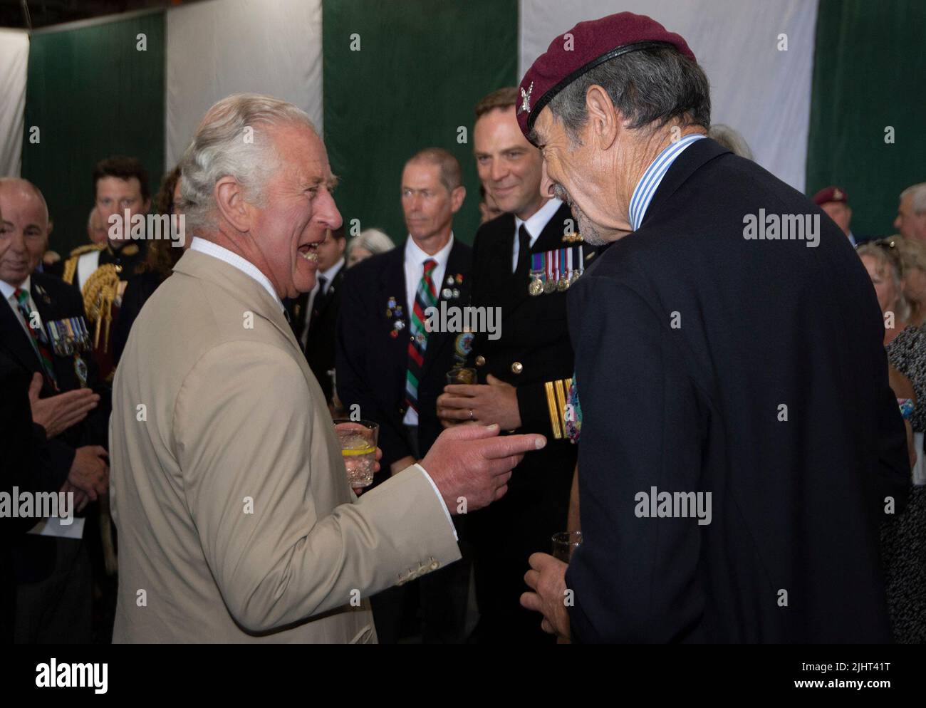 The Prince of Wales (left) talks to Falklands veteran Chris Jackson of C Company 2 Para during a reception to mark the 40th anniversary of the conflict on board the Royal Navy aircraft carrier HMS Queen Elizabeth. Picture date: Wednesday July 20, 2022. Stock Photo
