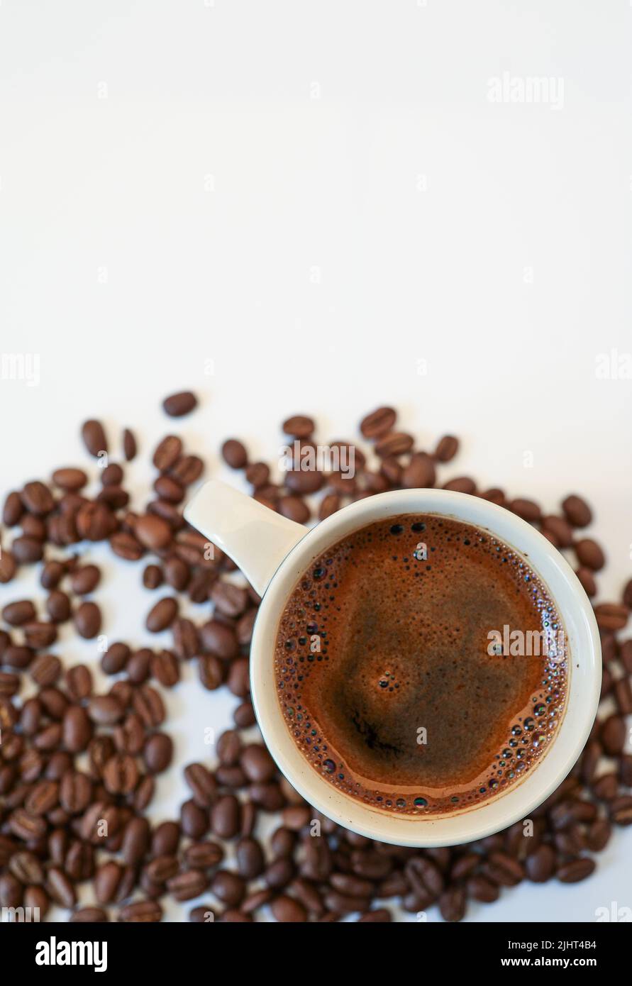 coffee beans on a white background with a cup of black coffee Stock ...