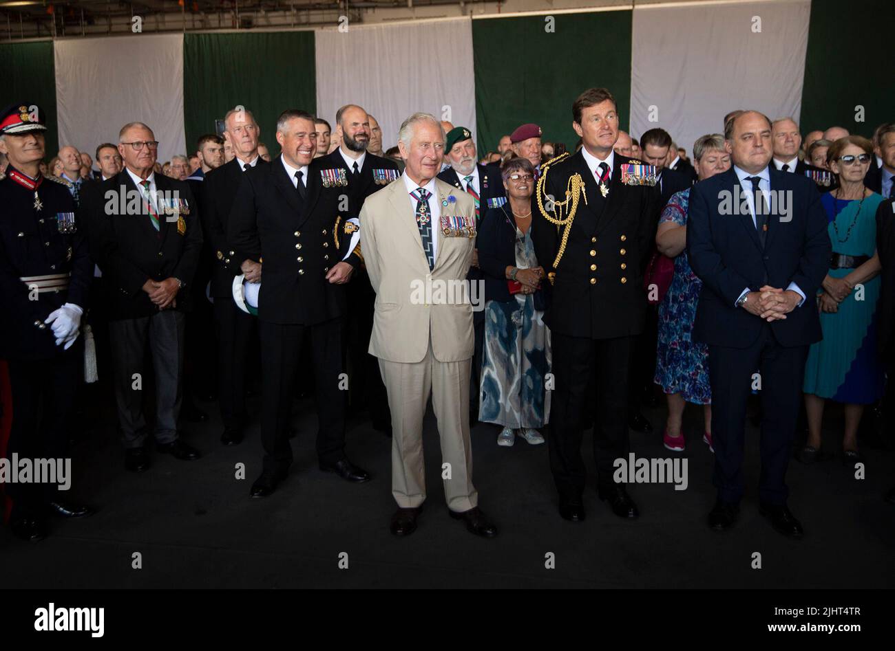 The Prince of Wales (centre) stands with guests during a reception on board the Royal Navy aircraft carrier HMS Queen Elizabeth, to mark the 40th anniversary of the conflict. Picture date: Wednesday July 20, 2022. Stock Photo