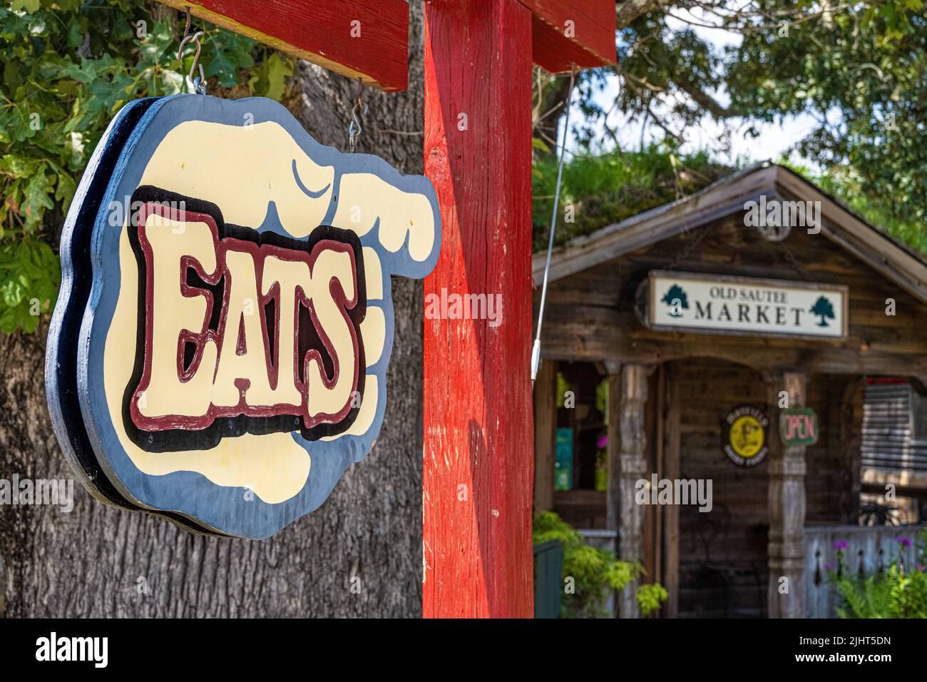 'Eats' sign pointing the way to Old Sautee Market offering fresh baked goods and hand crafted sandwiches for locals and visitors to Helen, Georgia. Stock Photo