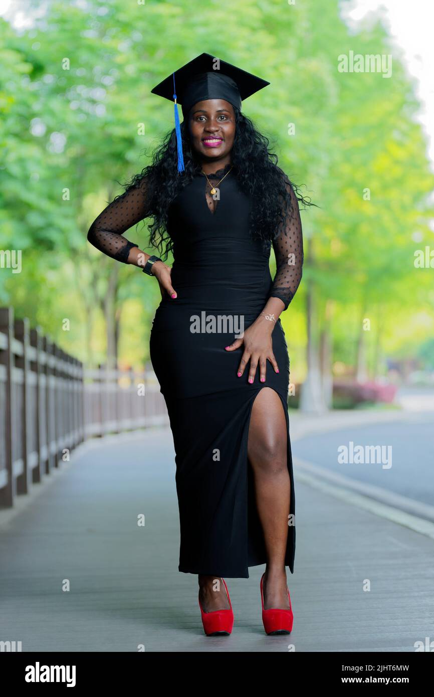 A vertical shot of an African girl graduating from university in ...