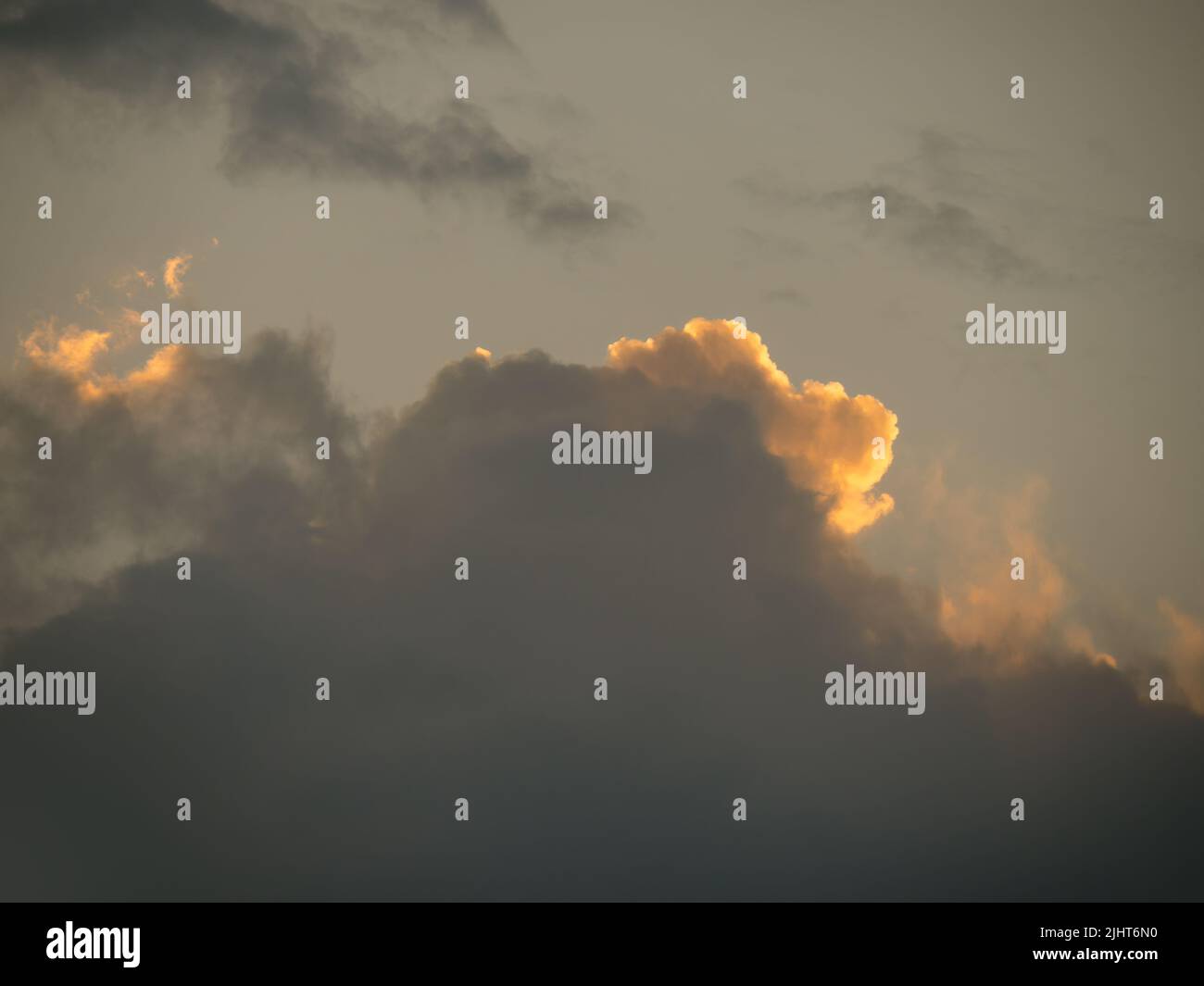 Cloud at sunset, red silver lining. Stock Photo