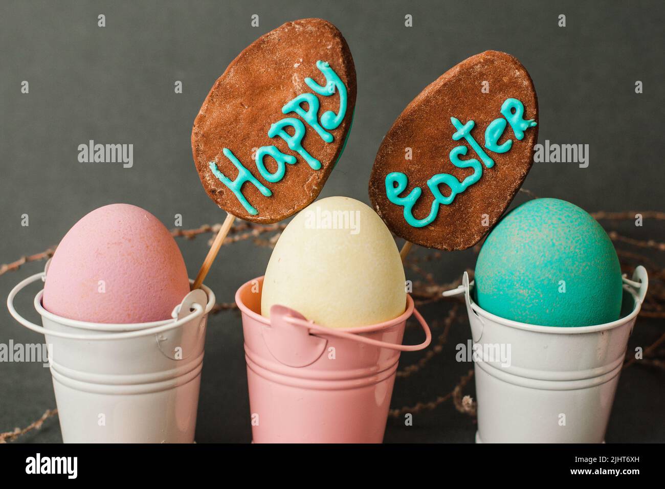 Color eggs in buckets. Happy easter background. Stock Photo