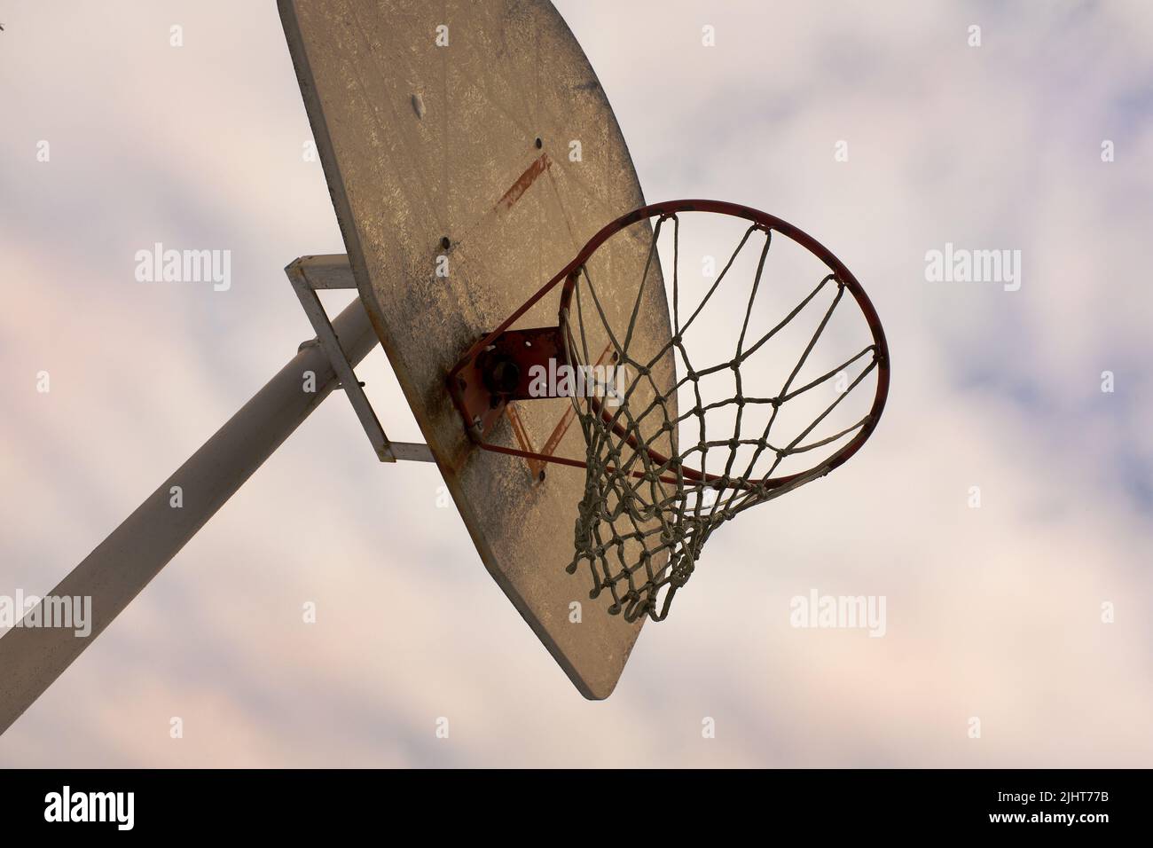 Low Angle View of Basketball Hoop and Backboard Stock Photo