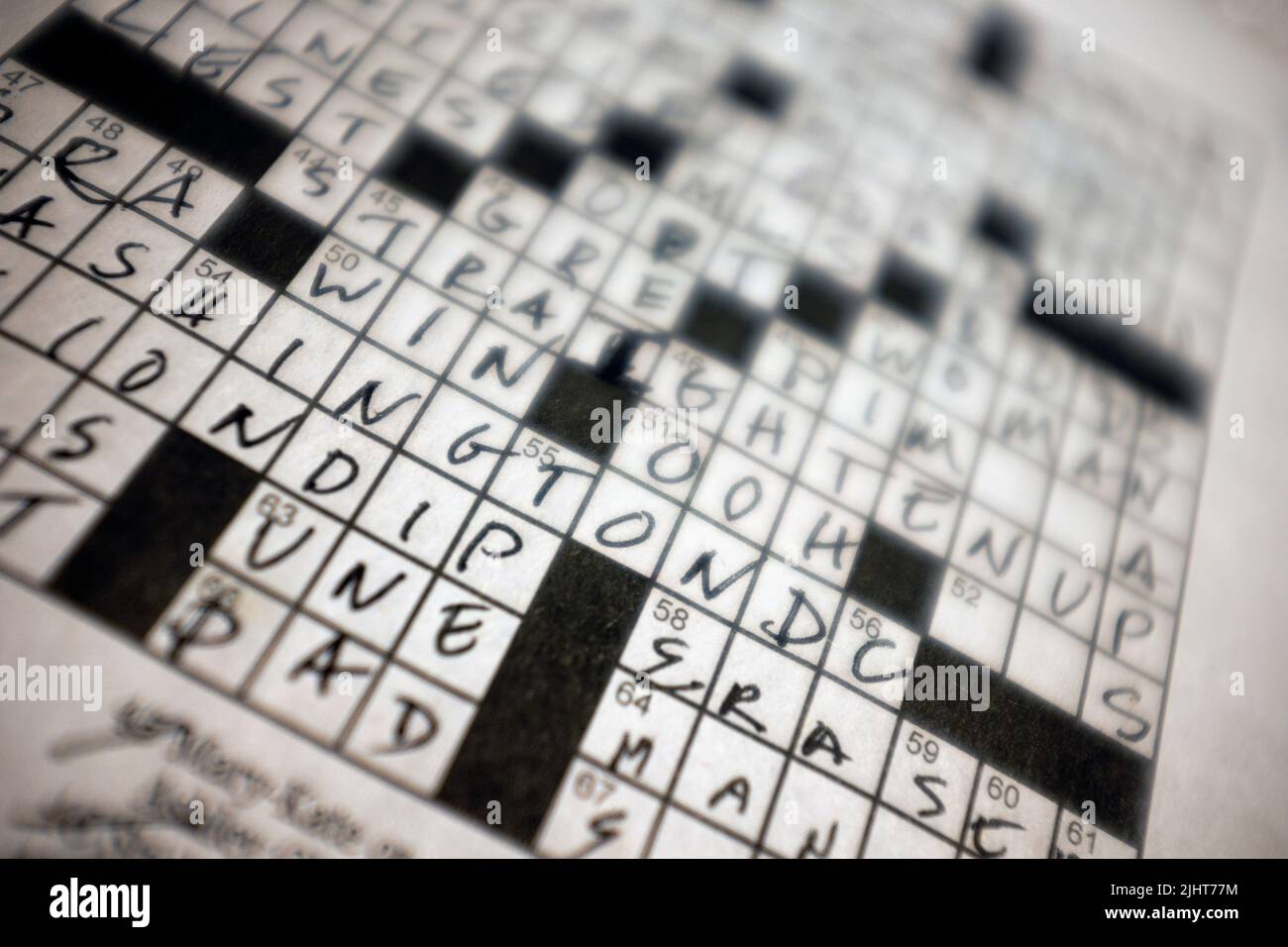 Almost Completed Newspaper Crossword Puzzle Stock Photo