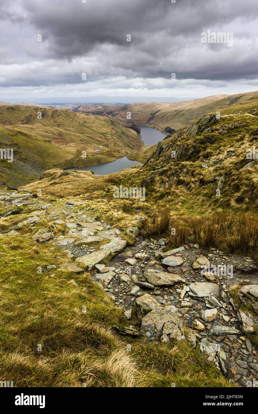 Nan Bield Pass bridleway above Small Water Tarn and Haweswater Reservoir in the Lake District National Park, Cumbria, England. Stock Photo