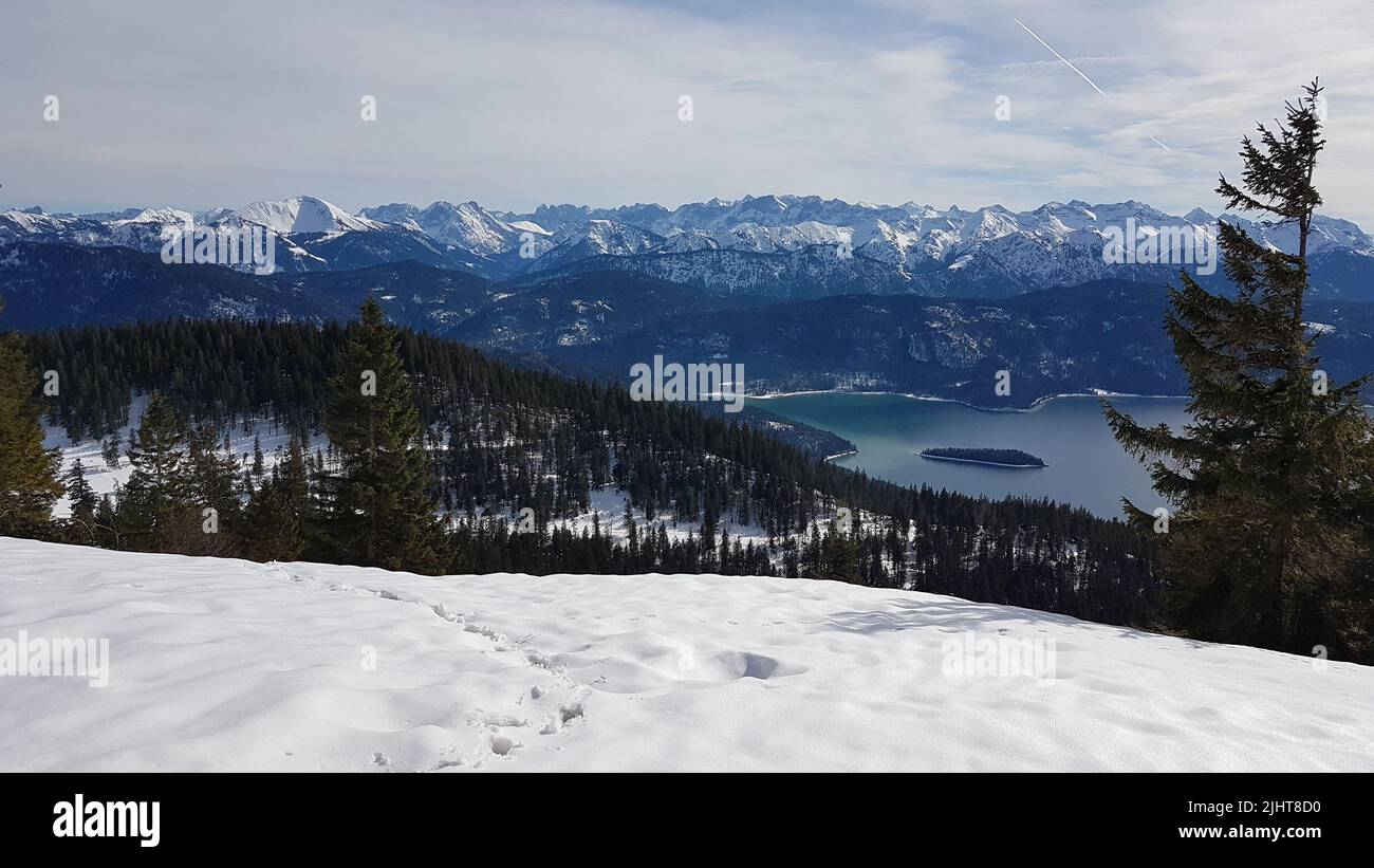 The Walchensee lake in Jochberg surrounded by mountains in winter Stock Photo