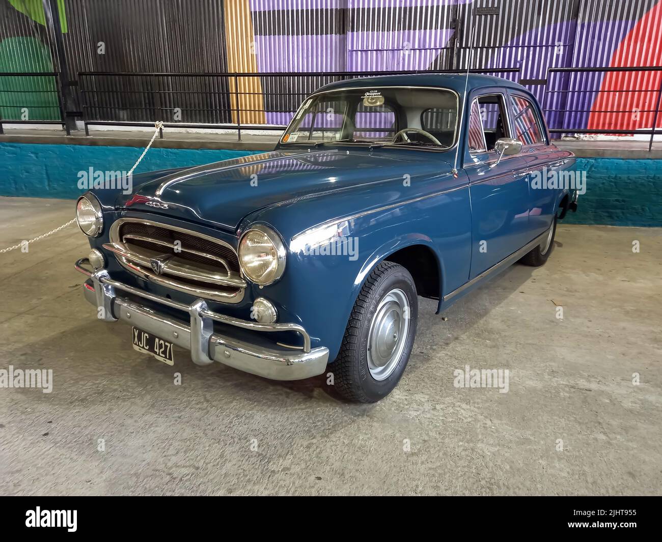 Avellaneda, Argentina - May 7, 2022: Old blue Peugeot 403 saloon, sedan, late 1950s in a warehouse yard. Expo Fierro 2022 classic car show Stock Photo