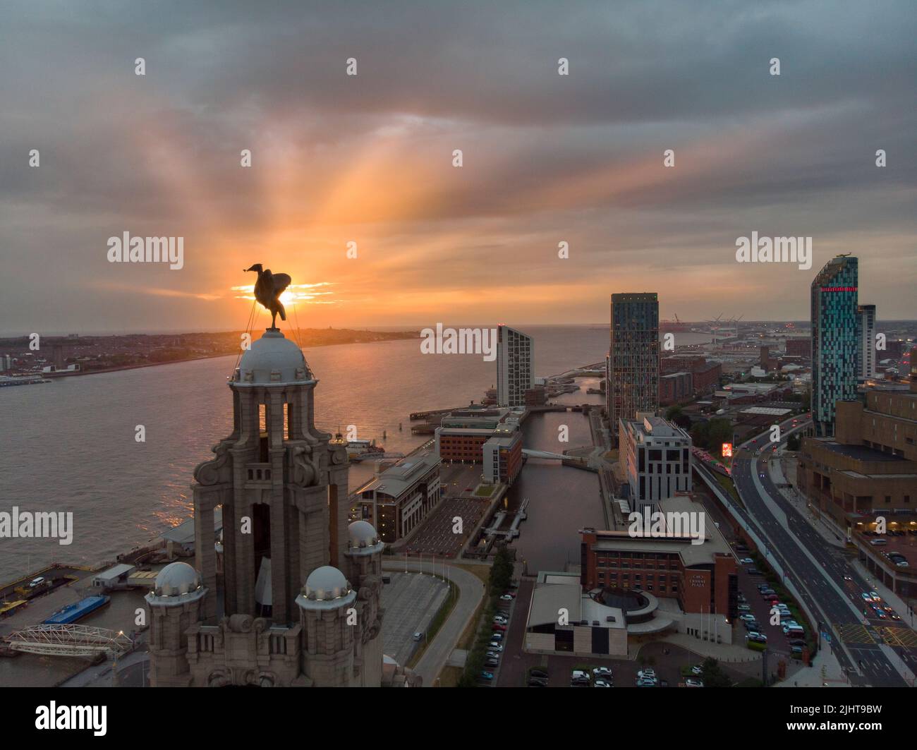 Liverpool skyline in the sunset over the river mersey Stock Photo