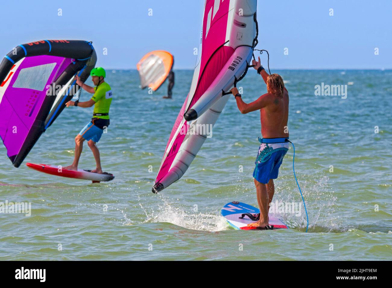 Wing foiling / wing surfing on the North Sea showing wingboarders