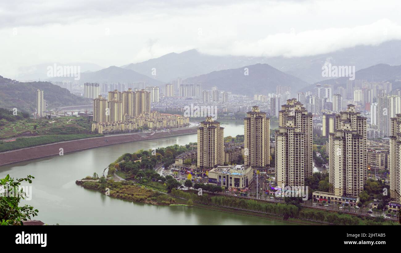 An aerial view of a cityscape with tall buildings and a river with ...