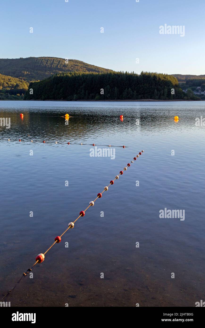 Laouzas Lake. Sunset. Buoys: swimming limit. Nages, Occitanie, France Stock Photo
