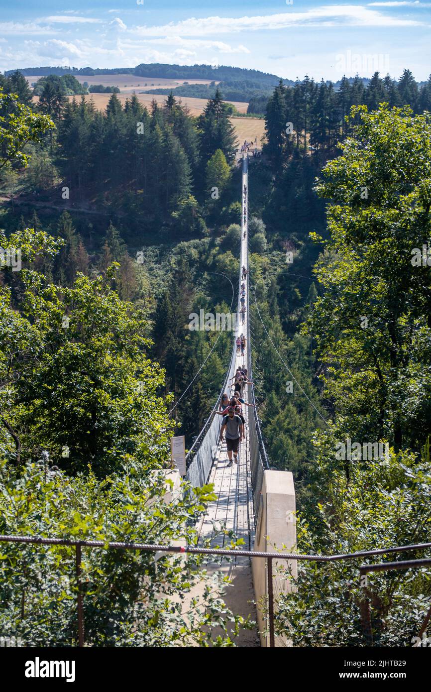 Moersdorf, Germany: August, 1. 2020: Geierlay suspension rope bridge, a pedestrian rope bridge between the local communities of Moersdorf and Sosberg Stock Photo
