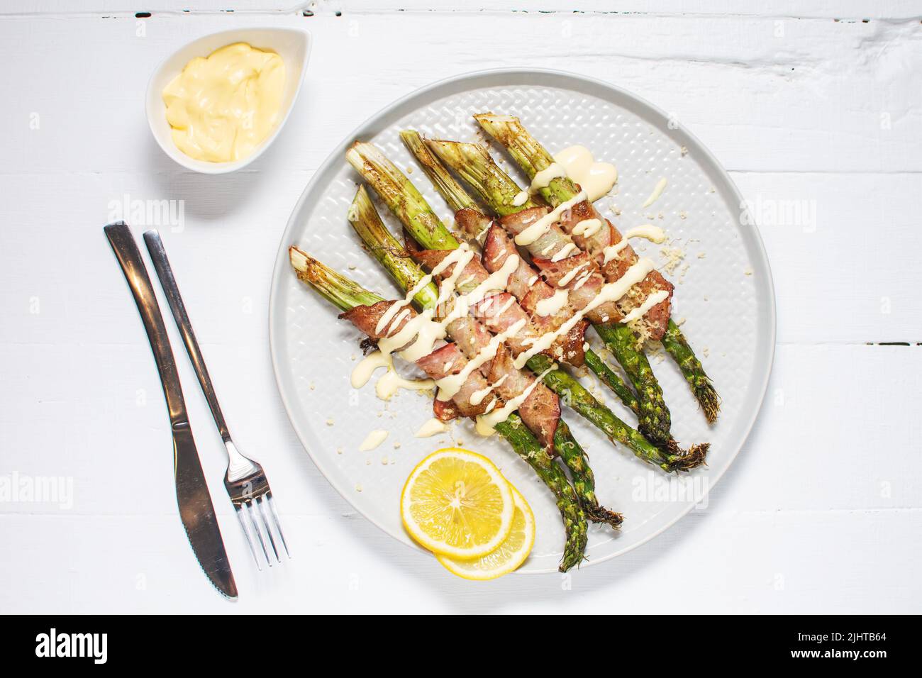 Grilled green asparagus wrapped with bacon. Ketogenic diet. Healthy food, diet menu. Top view, overhead Stock Photo