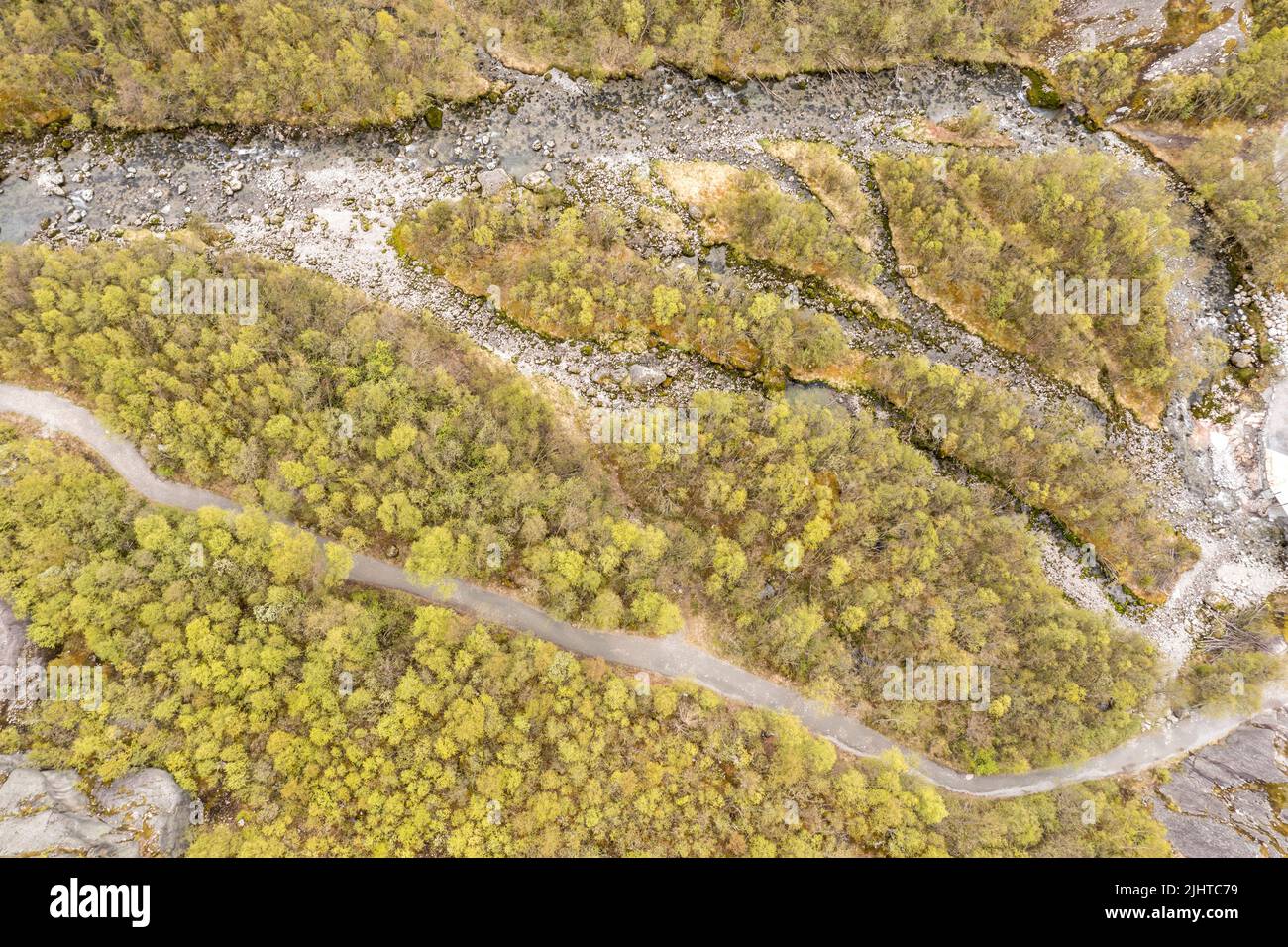Aerial view of river and path in a birch forest, path from parking lot to glacier Briksdalbre, Norway Stock Photo