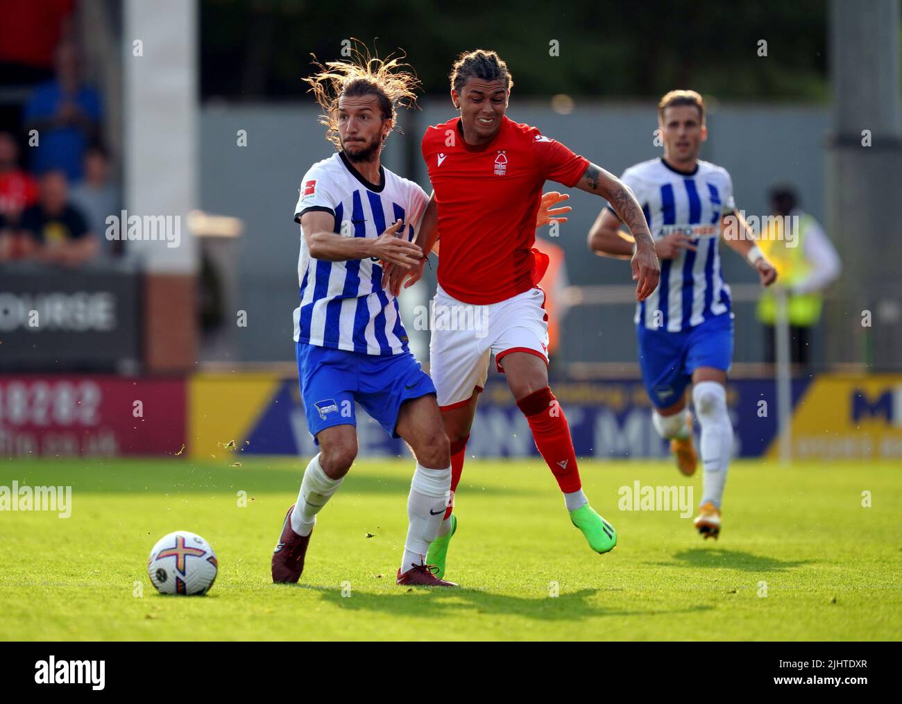 Nottingham Forest's Brennan Johnson and Hertha Berlin's Ivan Sunjic (left) battle for the ball during a pre-season friendly match at the Pirelli Stadium, Burton upon Trent. Picture date: Wednesday July 20, 2022. Stock Photo