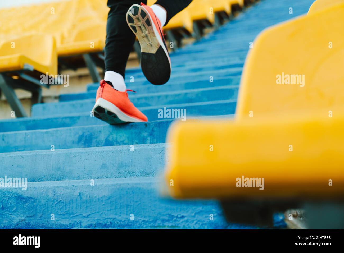 Man running up stadium stairs hi-res stock photography and images - Alamy