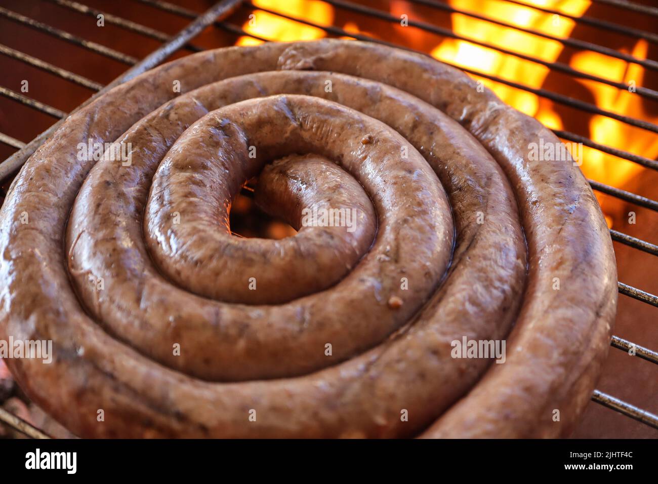 Boerewors sausage on a braai. Boerewors or braai wors, a South African  traditional sausage meat usually cooked on a braai or bbq. Barbecue meat  Stock Photo - Alamy
