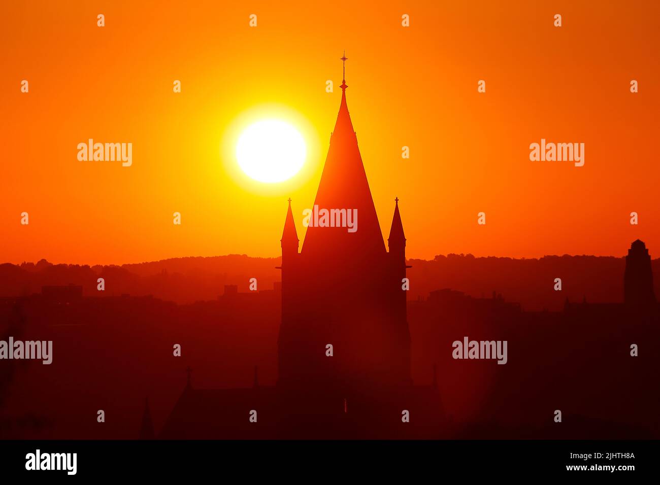 The sun rising behind St Bartholomews Church in Wortley,Leeds,West Yorkshire Stock Photo