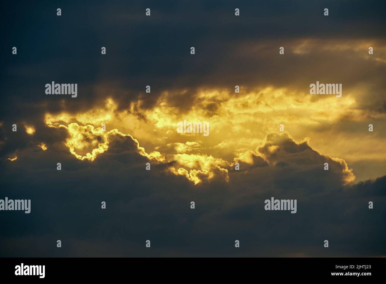 Dusk sun breaks through clouds hi-res stock photography and images - Alamy