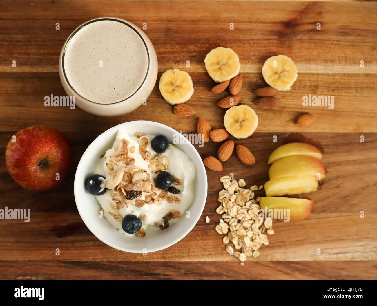 Healthy banana smoothie including oats, banana, almond milk Stock Photo