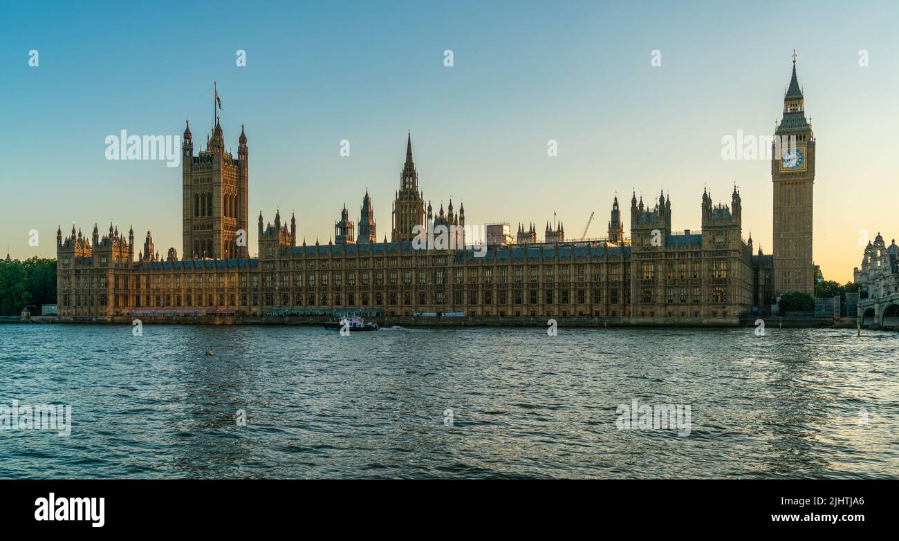 Panorama of The Houses of Parliament, Big Ben and Westminster Bridge by The River Thames at dusk or sunset, London, England Stock Photo