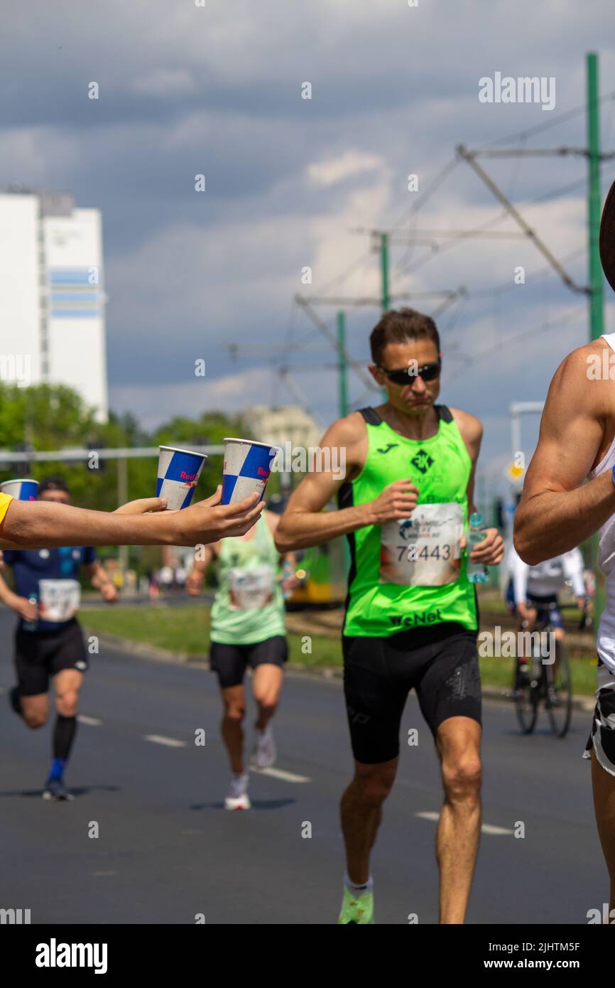 The volunteers offering water to the runners at Wings for Life World