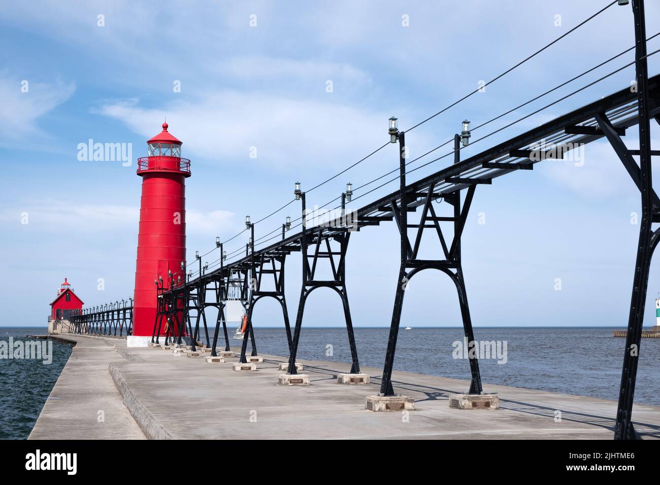 Landscape of the Grand Haven Lighthouse, pier, and catwalk, Lake Michigan, Michigan, USA Stock Photo