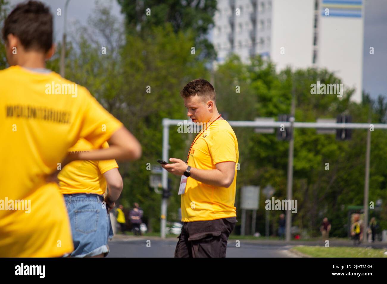 The volunteers in yellow shirts at Wings for Life World Run Stock Photo