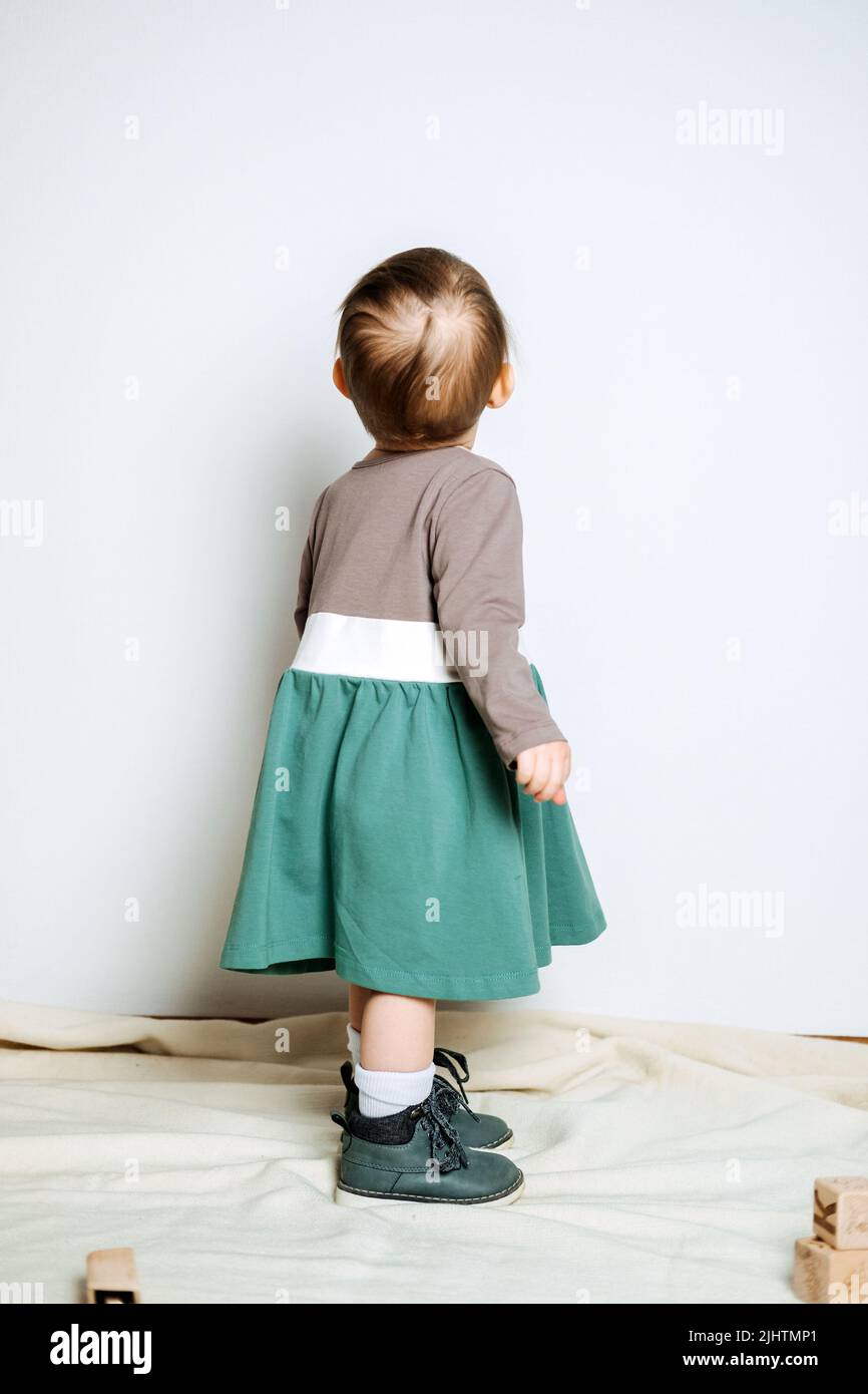 Baby fashion. Unisex color clothes for babies. Cute baby girls in