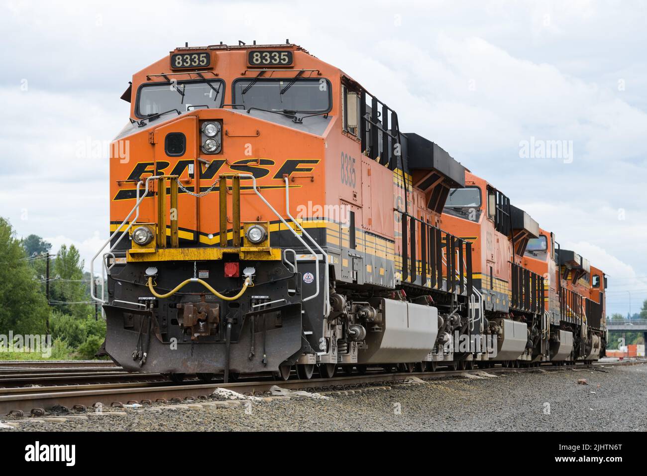 Seattle - July 17, 2022; BNSF frieght engines in traditional orange and yellow livery waiting for duty on a train Stock Photo