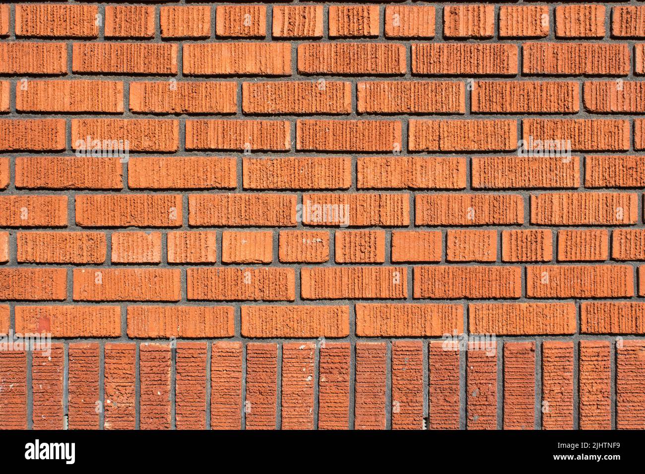 Old Bright, Red And Orange Brick Wall Texture. Strong Brickwork Seamless. Shabby Building Facade. Perfect Stonework Backdrop. Stock Photo