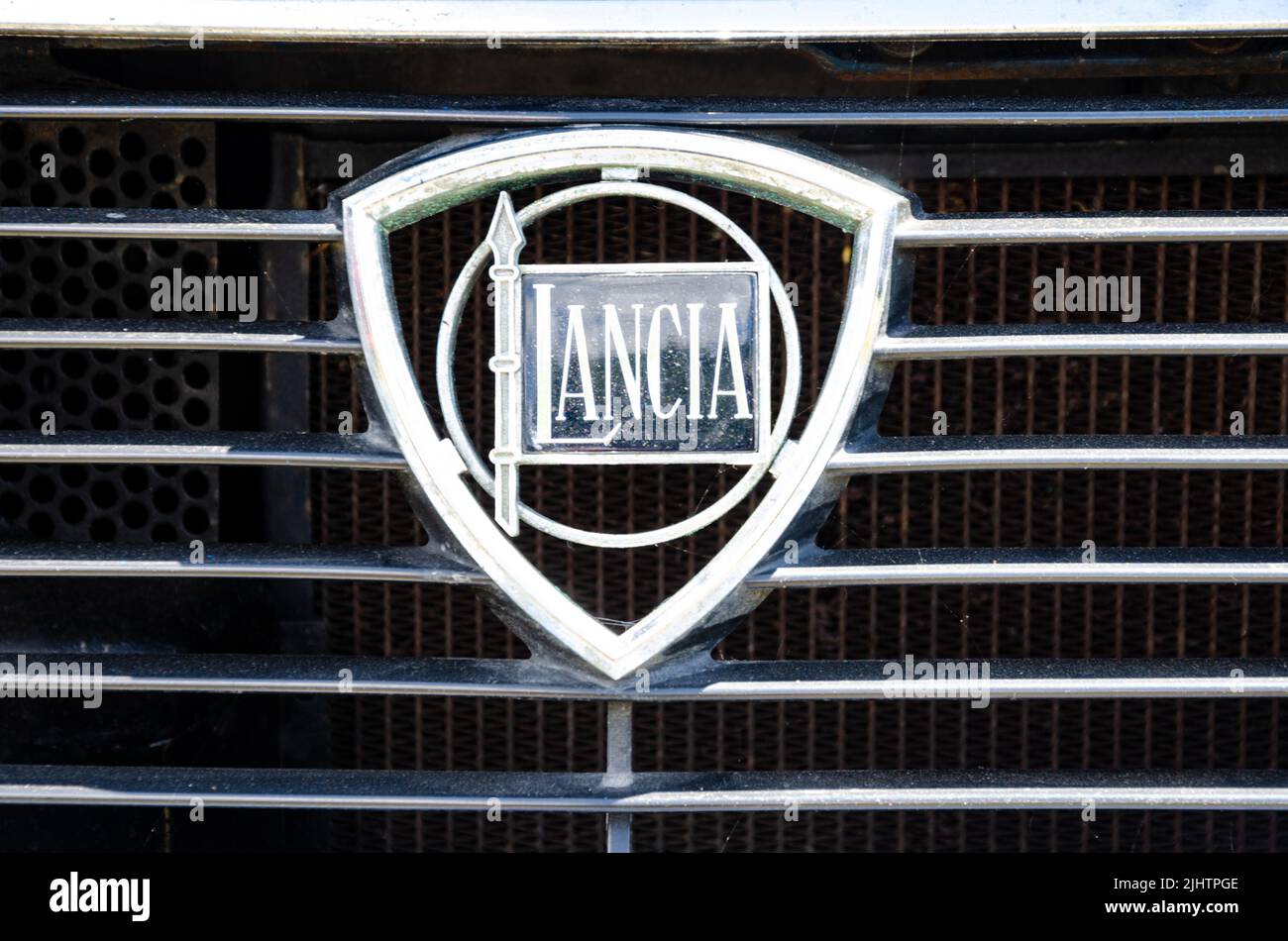 Close up view of a Lancia badge on the front grill of a classic Lancia car at The Berkshire Motor Show in Reading, UK Stock Photo