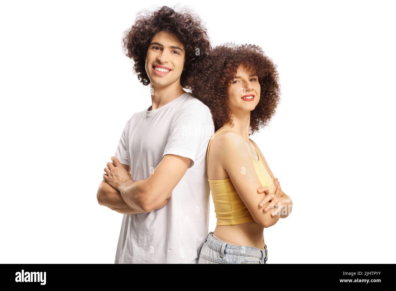 Couple with curly hair smiling and posing back to back isolated on white background Stock Photo