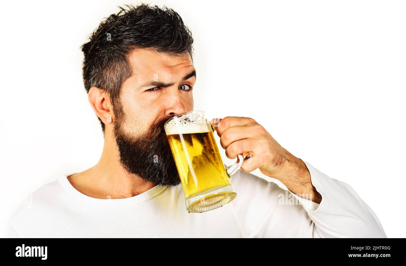 Oktoberfest. Bearded man drinking mug of beer. Alcohol, bad habit. Brewing. Stylish guy at cafe pub Stock Photo