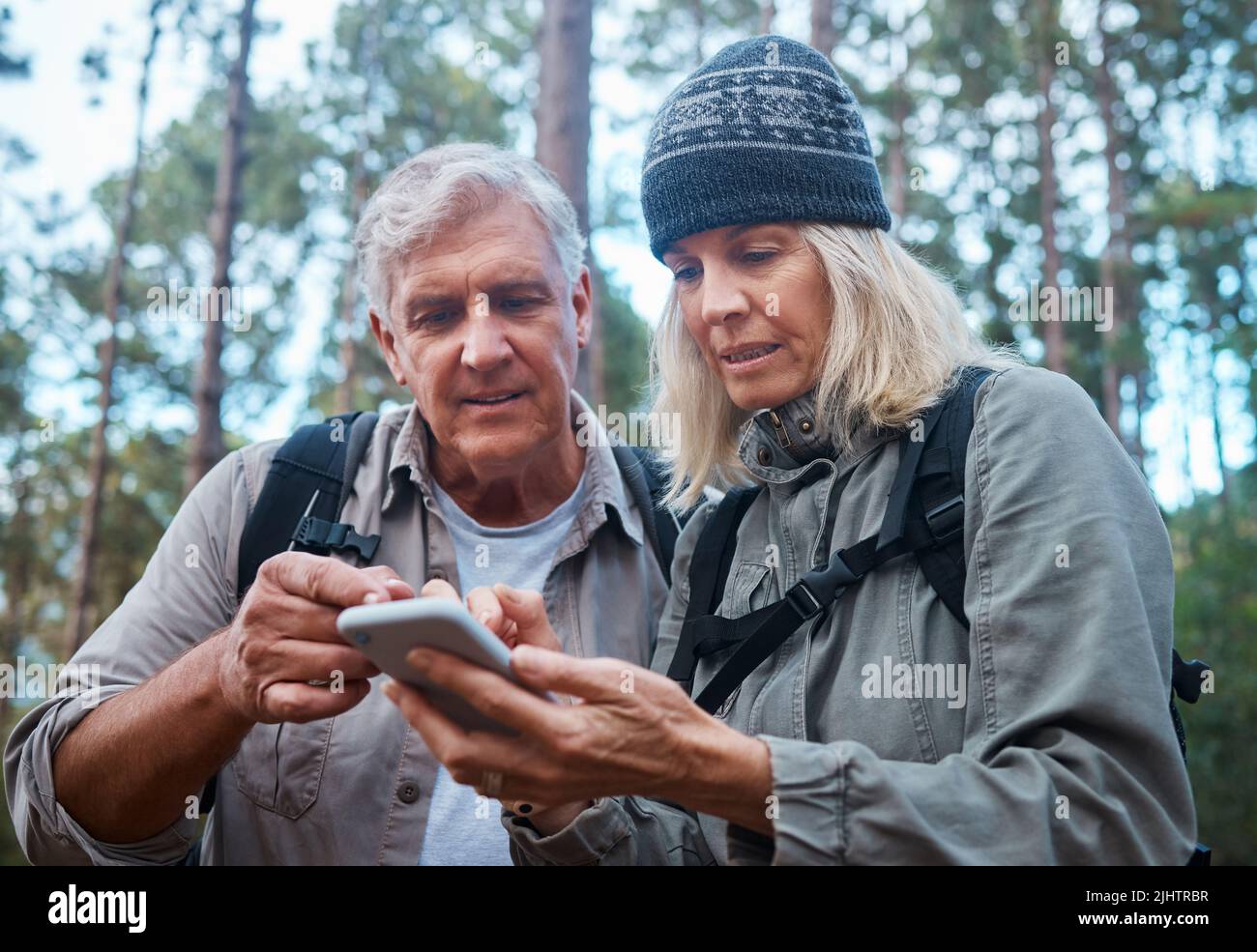 Mature woman hiking on trail hi-res stock photography and images - Alamy