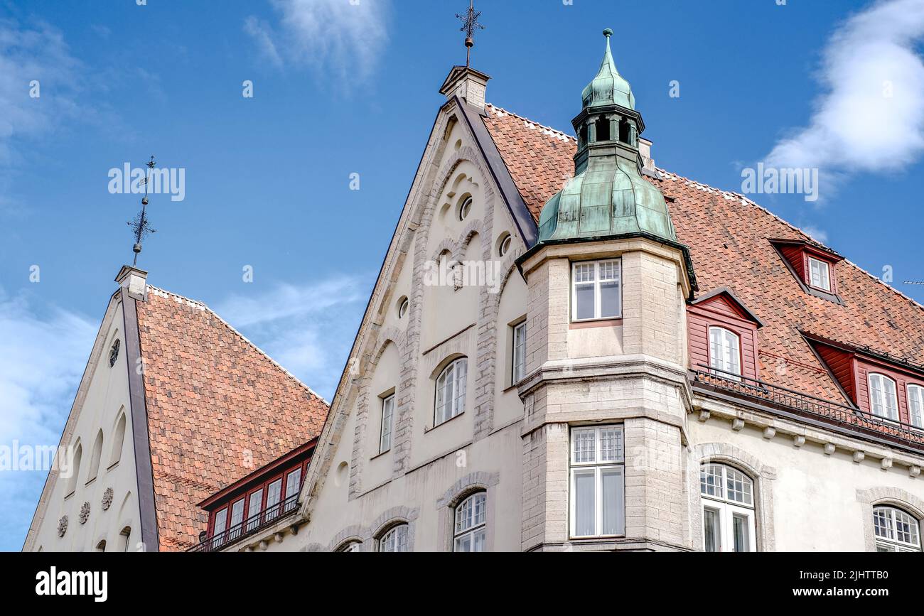 The old town - the oldest part of Tallinn in Estonia with orange tiled roofs and ancient buildings Stock Photo